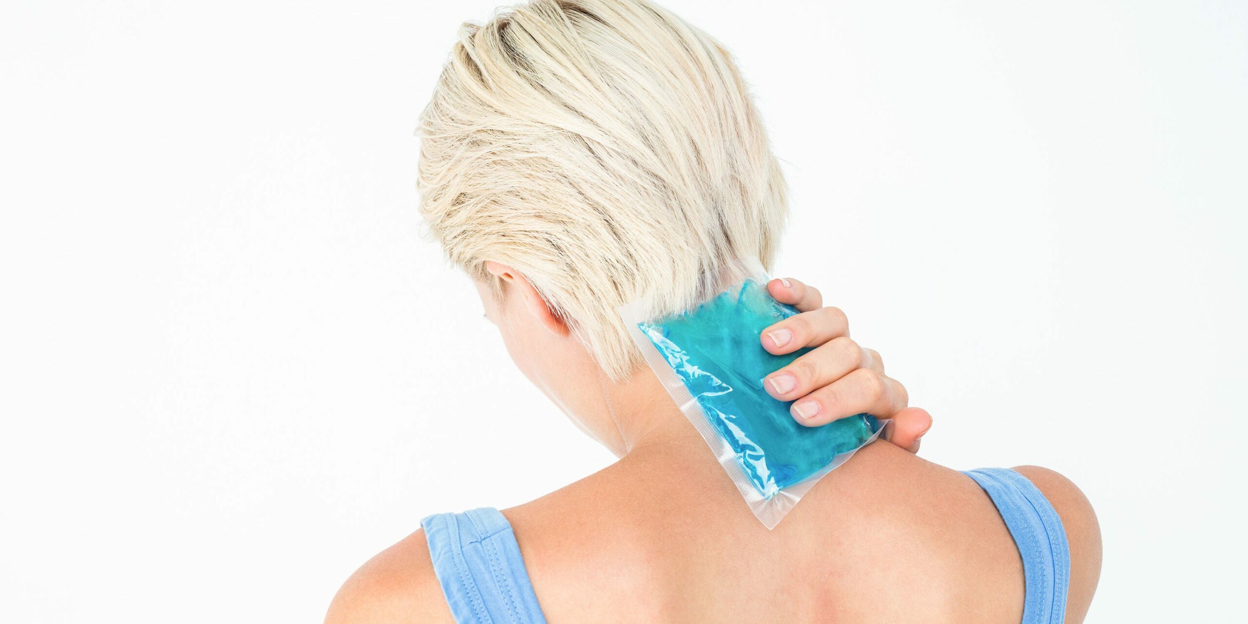 woman holding an ice pack to the back of her neck