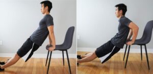 man performing a tricep dip exercise with his hands on the front edge of a chair