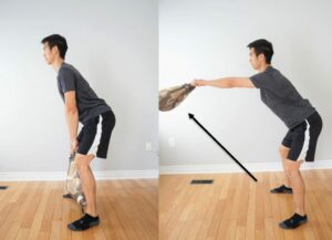 man performing a kettle bell swing exercise using a heavy grocery bag