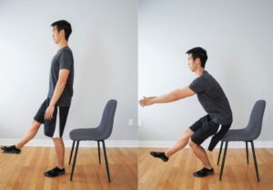 man performing a single leg squat with a chair behind him