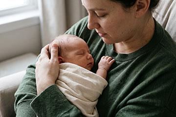 woman-holding-her-newborn-baby