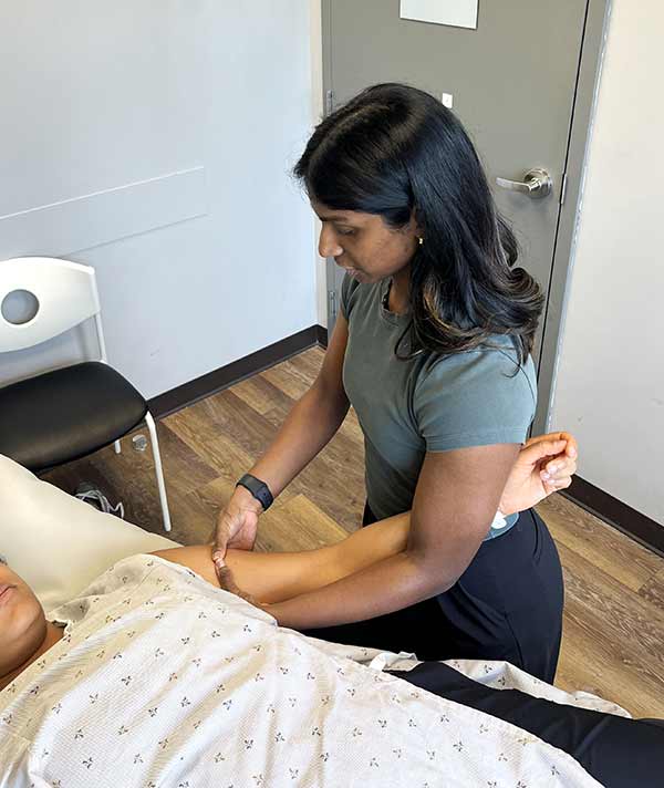 physiotherapist-treating-a-female-patient-for-breast-cancer-rehabilitation-physiotherapy