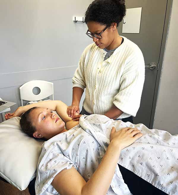 woman-receiving-physiotherapy-treatment-after-breast-cancer-surgery