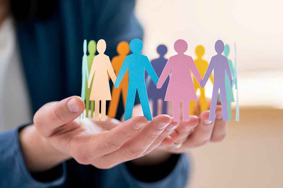 person-holding-a-paper-cutout-of-gender-diverse-people-holding-hands-preview