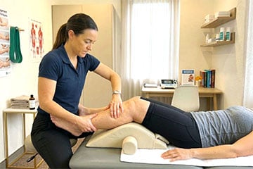 physiotherapist-treating-a-patient's-leg-who-has-lymphedema-preview