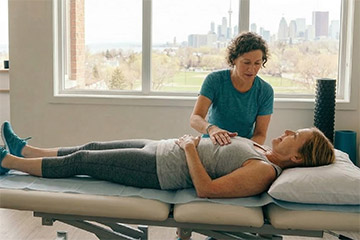 woman-after-colorectal-cancer-treatment-being-treated-by-a-physiotherapist-preview